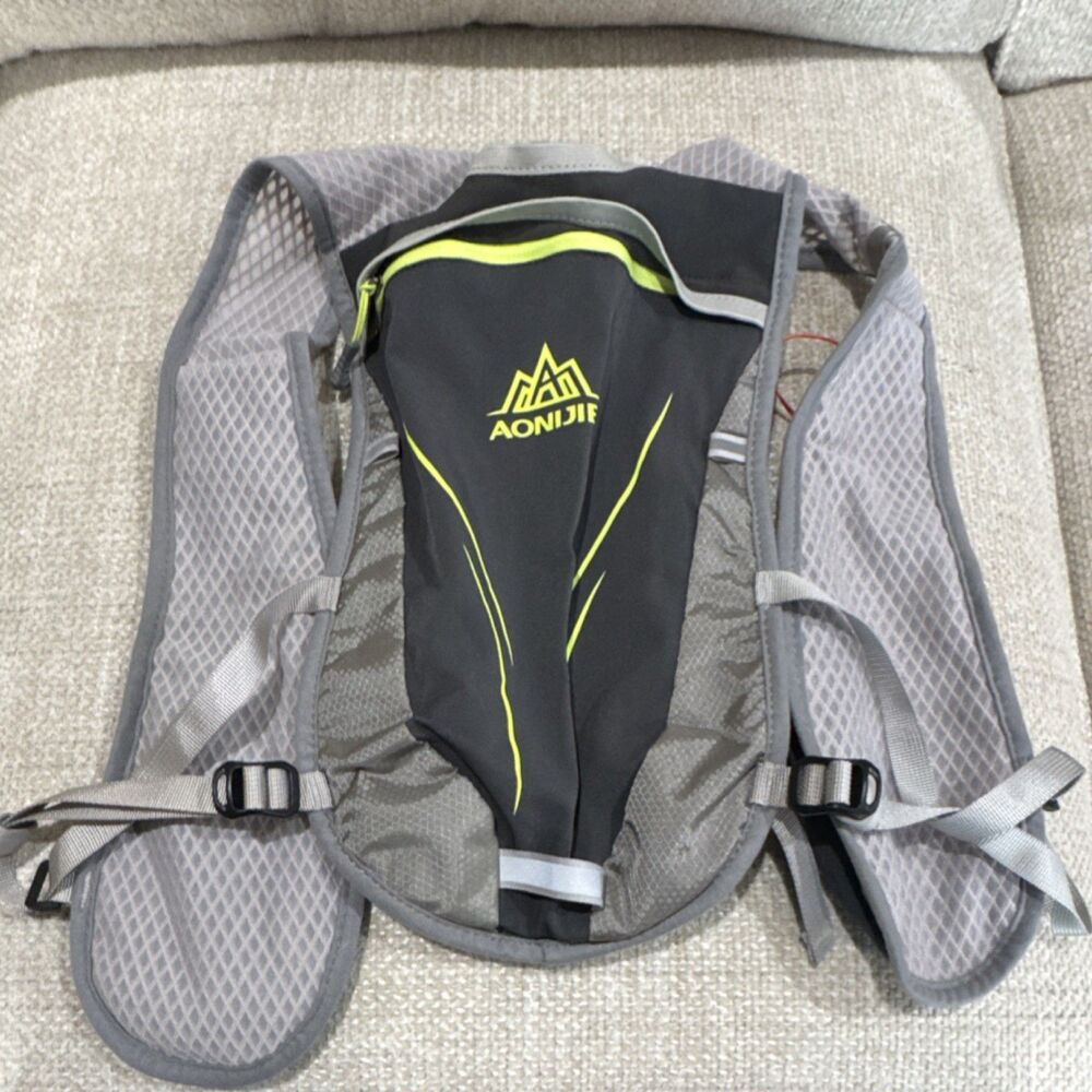 AONIJIE Hydration Pack Gray Black Yellow Strap Accents Lightweight Hiking